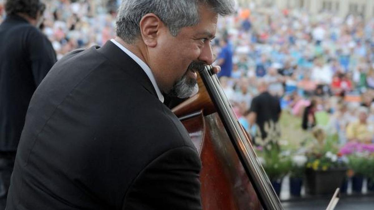 
Raymond Vargas warms up before the 20th annual Modesto Symphony Orchestra Picnic at the Pops season-opener show featuring Neil Diamond tribute act Super Diamond Saturday, Sept. 6, 2014. 
