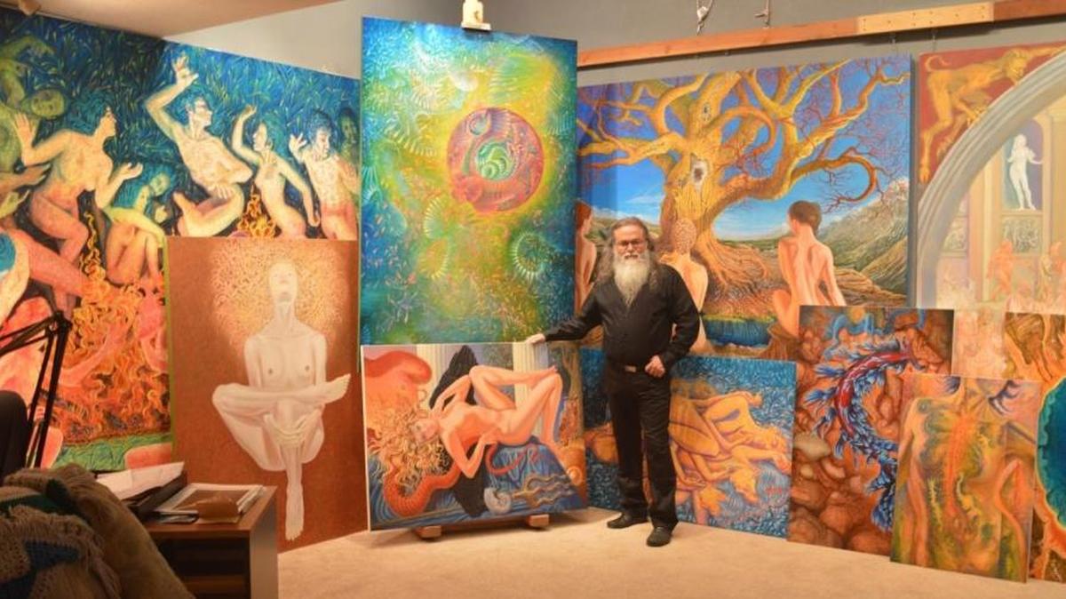 Richard Serros with his works set for a two-gallery retrospective.