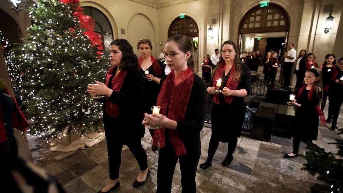 Members of Candy Choristers take part in the processional during the 2016 Modesto Symphony Orchestra Holiday Candlelight Concert at St. Stanislaus Catholic Church.