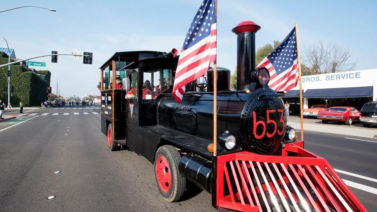 Stanislaus Voiture 653 parade vehicle drives down Needham Street during the 2016 Veterans Day Parade in Modesto.