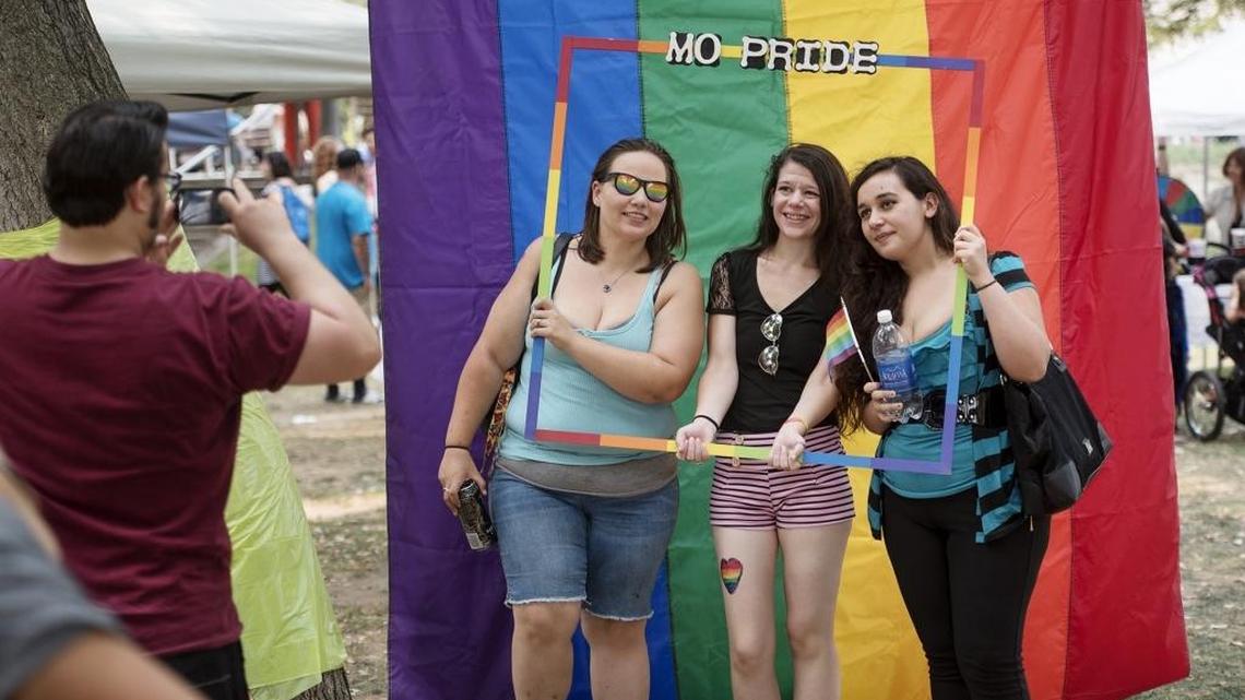 From left, Ashley Wells, Sara Teem and Crystal Avina, all of Modesto, pose for a photo during MoPride on the Park at Graceada Park in Modesto, Calif., on Saturday, September, 12, 2015.