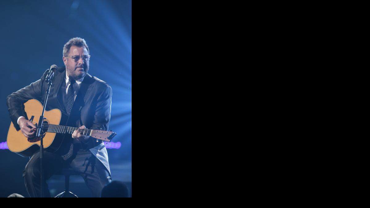 
This image released by NBC Universal shows country singer Vince Gill during the Healing in the Heartland: Relief Benefit Concert at the Chesapeake Energy Arena in Oklahoma City, Okla., Wednesday, May 29,2013.
