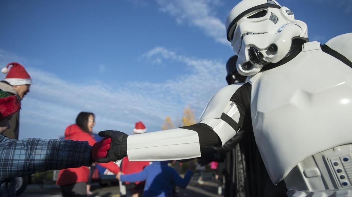 A stormtrooper of the 501st Legion Central California Garrison visits the Rancho Cordova Police Activities League holiday run Saturday. Group members will be at ‘The Force Awakens’ screenings in downtown Modesto from Thursday through Saturday.