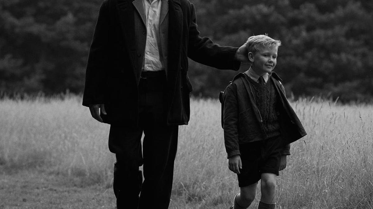 Jamie Dornan, left, and Jude Hill in the film “Belfast,” playing at the State Theatre.