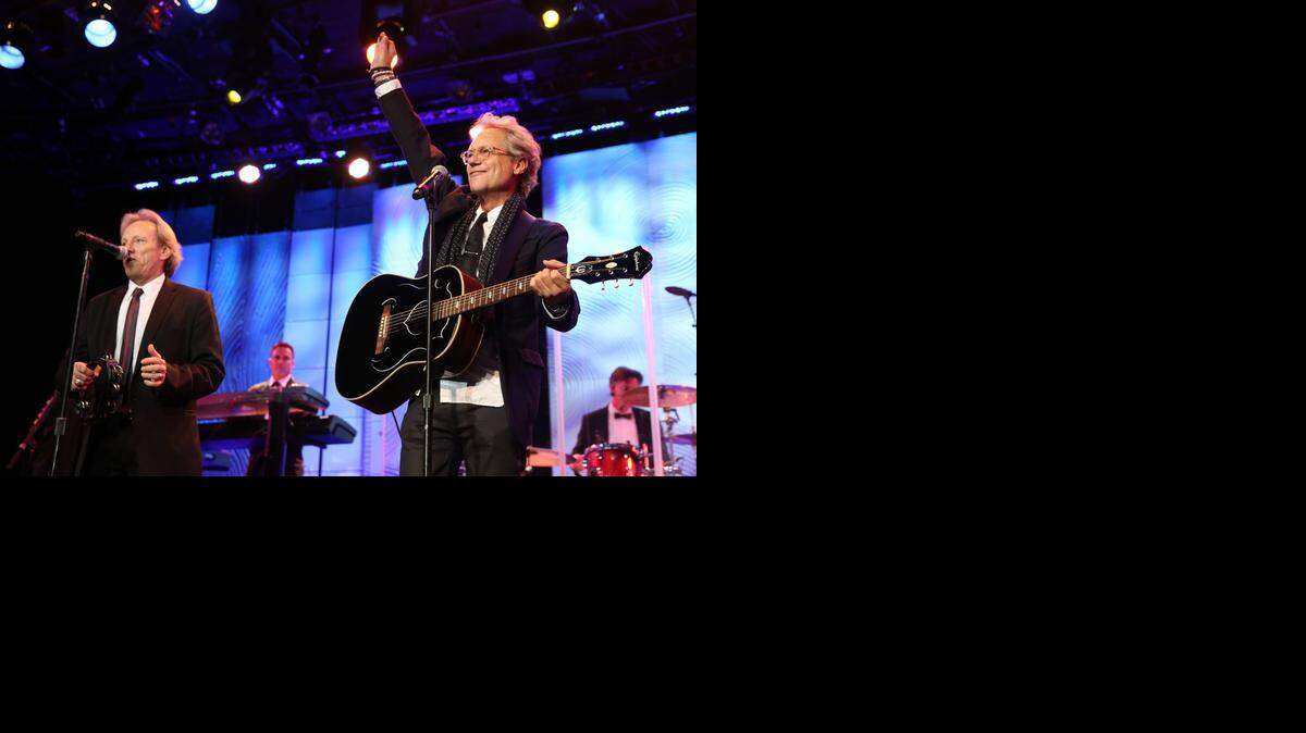
Dewey Bunnell, left, and Gerry Beckley, of the band America, perform in February in Beverly Hills.
