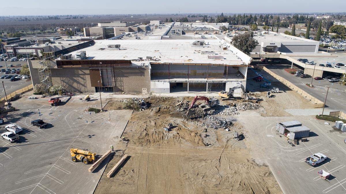 A construction crew works on the former Sears store at Vintage Faire Mall in Modesto, Calif., on Thursday, Feb. 6, 2020.