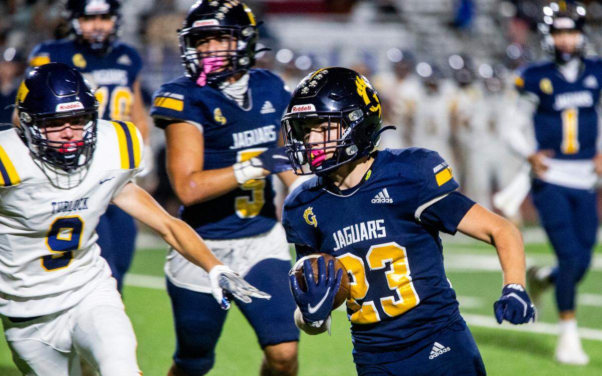 Michael Marsden, 23 of Gregori works his way upfield with Colten Mauksch, 9, of Turlock High working his way over Thursday Sept. 28, 2023.