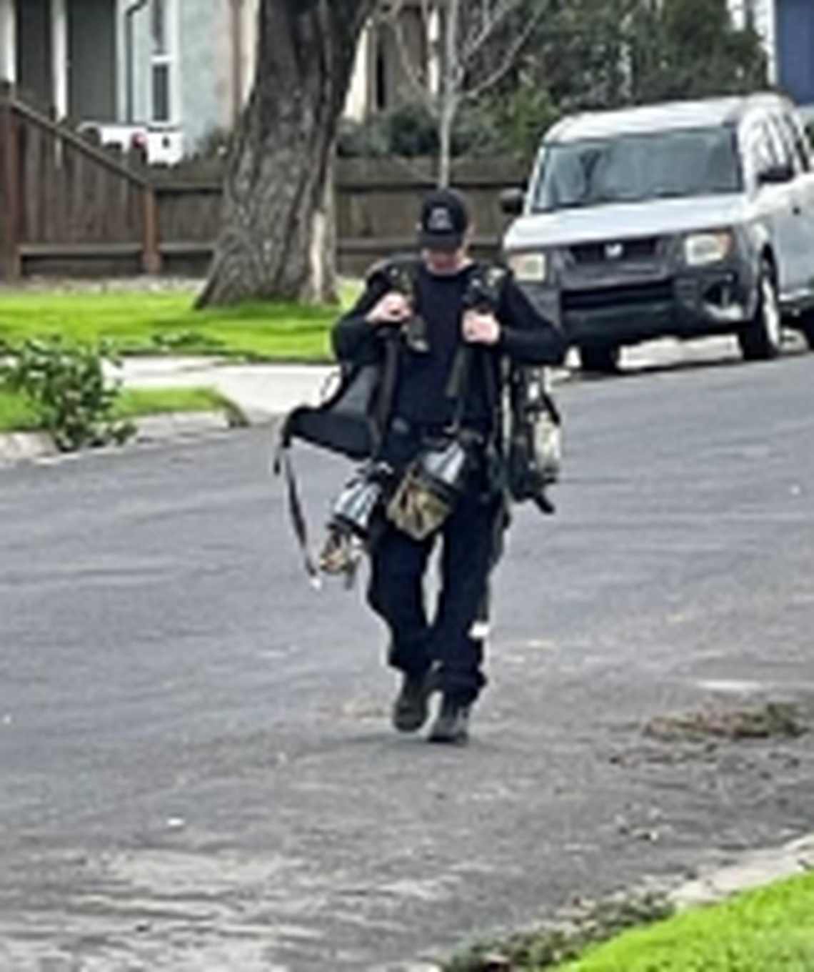A Modesto Fire Department SWAT medic arrives at the scene of an arrest on the 300 block of Corvena Avenue in Modesto on Thursday, Feb. 8, 2024.
