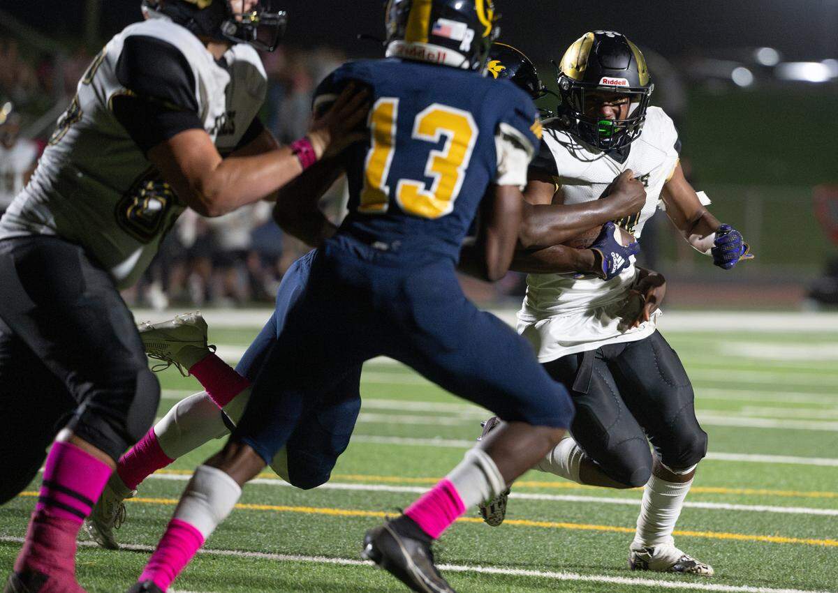 Enochs’ Aiden Muhammad is stopped by Gregori’s Marcus Sims in the red zone on fourth down during the Central California Athletic League game at Gregori High School in Modesto, Calif., Friday, Oct. 6, 2023.