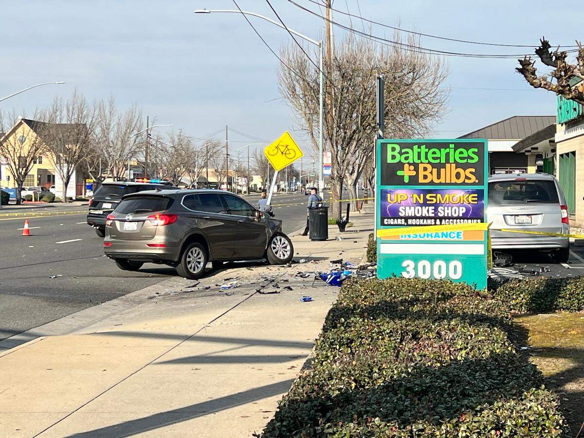 Modesto police investigate a fatal accident involving a motorcycle and a car Saturday afternoon on McHenry Avenue in Modesto, Calif. Jan. 15, 2022