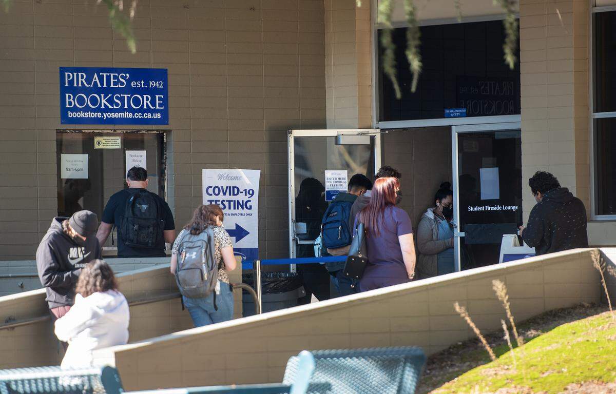 Students line up for required Covid-19 test at Modesto Junior College east campus in Modesto, Calif., on Tuesday, Jan. 11, 2022.