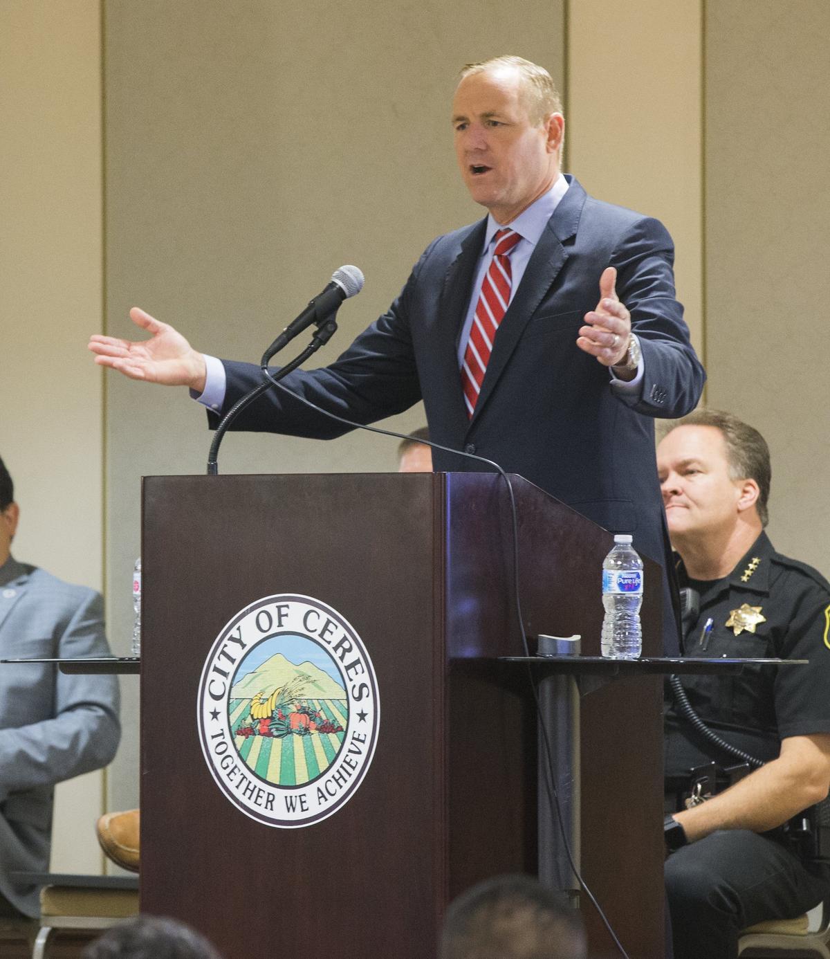 Congressman Jeff Denham talks to a large group of new US citizens during a Naturalization Ceremony at the Ceres Community Center Monday July 31, 2018.