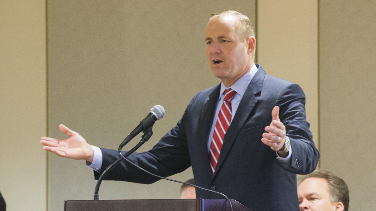 Congressman Jeff Denham talks to a large group of new US citizens during a Naturalization Ceremony at the Ceres Community Center Monday July 31, 2018.