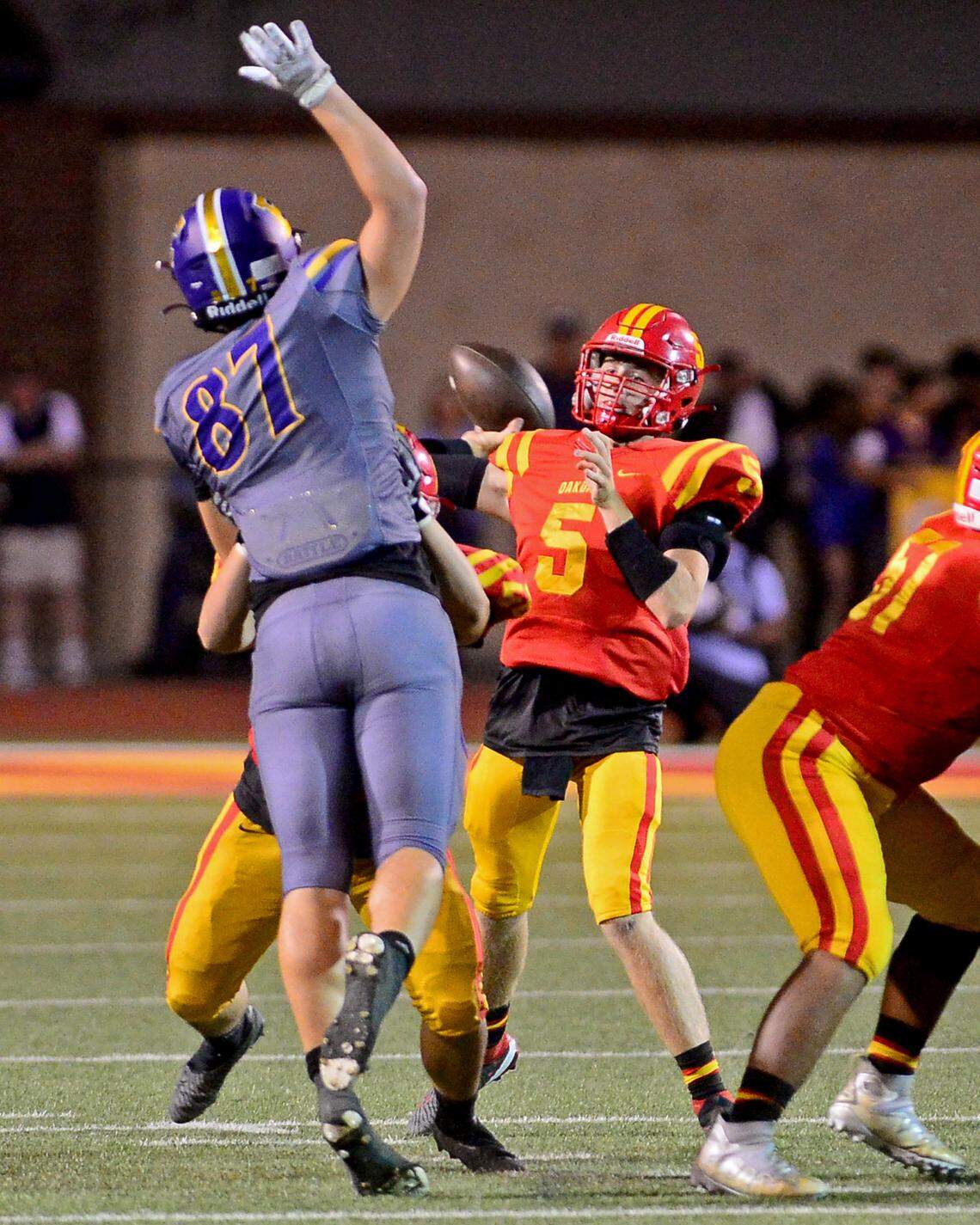Oakdale quarterback Tommy Chance (5) throws a deep pass during a game between Oakdale and Escalon at Oakdale High School in Oakdale, California, on September 15, 2023.