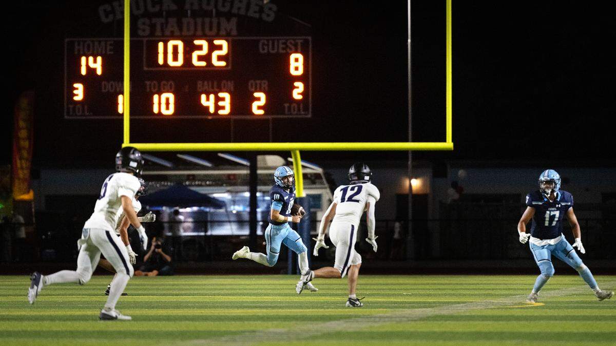 Downey quarterback Carson Lamb runs the ball during the non-league game with Amador Valley at Downey High School in Modesto, Calif., Friday, Sept. 13, 2024.