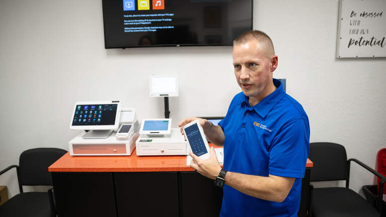 Modesto business charging debit card fee? It’s prohibited in CA. How to report