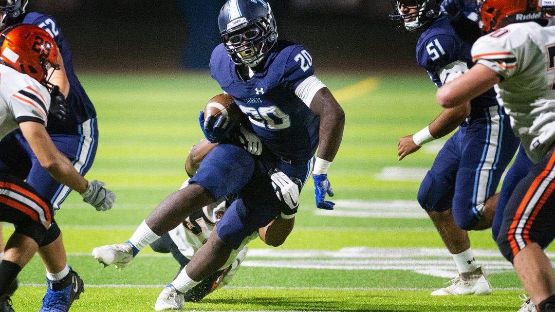 Downey’s Kimoni Ragland runs the ball during a non-league game with Merced at Downey High School in Modesto, Calif., on Friday, Sept. 3, 2021.