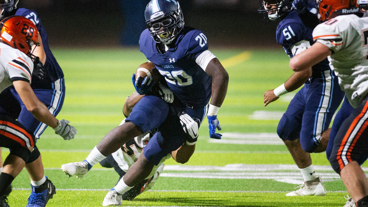 Downey’s Kimoni Ragland runs the ball during a non-league game with Merced at Downey High School in Modesto, Calif., on Friday, Sept. 3, 2021.