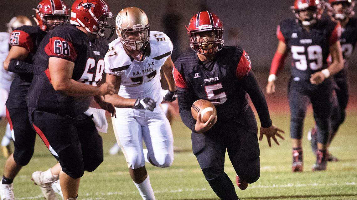 Modesto’s James Hayes breaks free for a long gain during a non-league game with Stagg at Downey High School in Modesto, Calif., on Friday, Sept. 21, 2018. Modesto won the game 26-16.