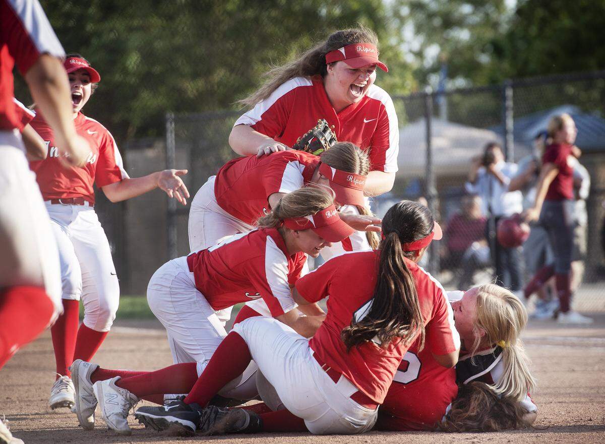 Ripon players celebrate their CIF Sac-Joaquin Section Division IV Championship victory over Calaveras at the Arnaiz Softball Complex in Stockton, Calif., Friday, May 24, 2019. Ripon won the game 7-3.