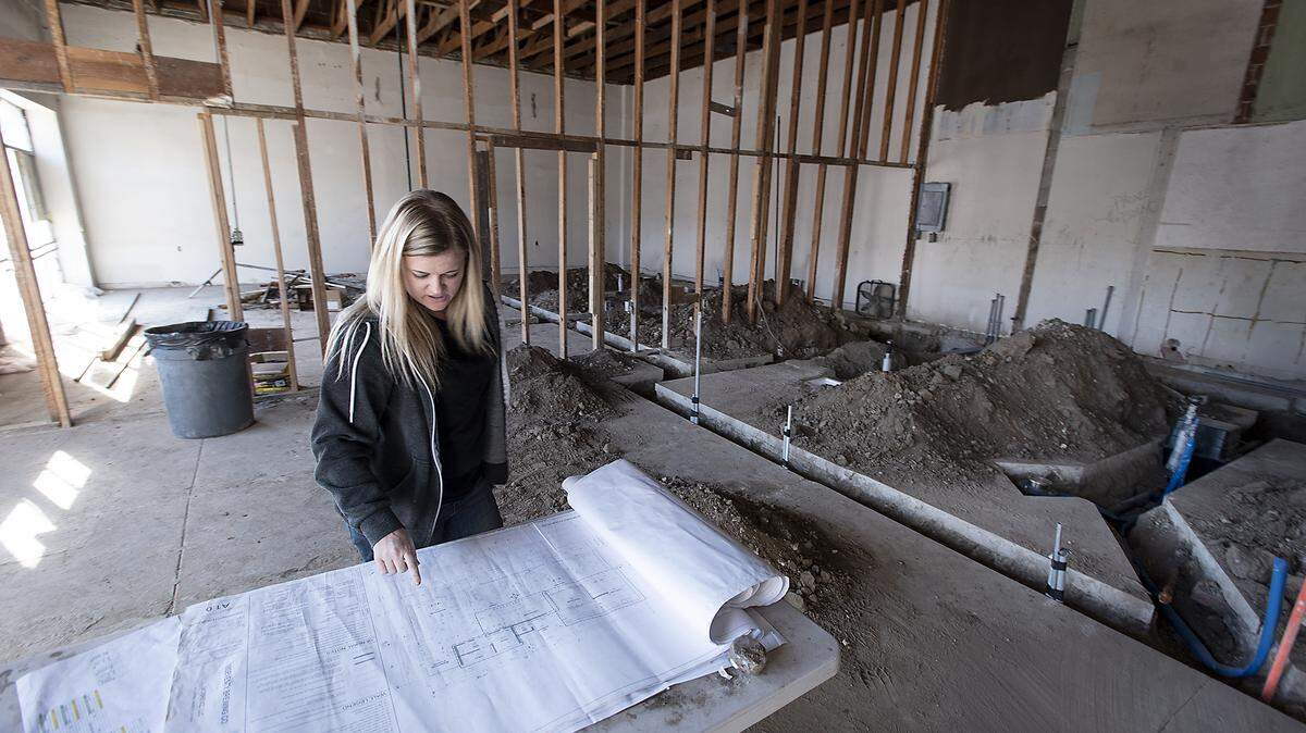 18Seventy Brewing Co. owner Bridgette Berry looks over plans for her new brewery being constructed in a building at 911 J Street in downtown Modesto, Calif., Saturday, Nov. 9, 2019.