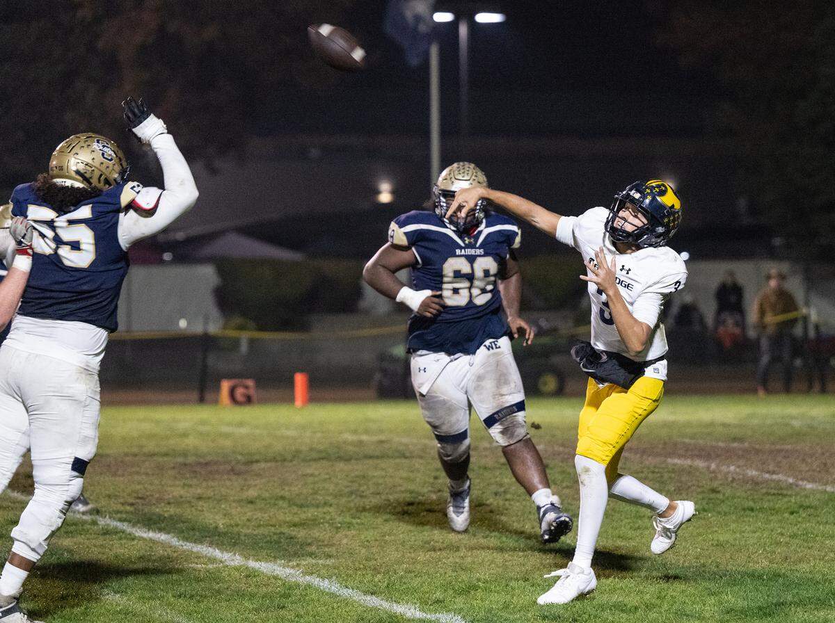 Oak Ridge quarterback Joaquin Graves-Mercado throws an 81-yard touchdown pass to Kaleb Edwards during the Sac-Joaquin Section semifinal playoff game with Central Catholic at Central Catholic High School in Modesto, Calif., Friday Nov. 17, 2023. Oak Ridge won the game 31-14.