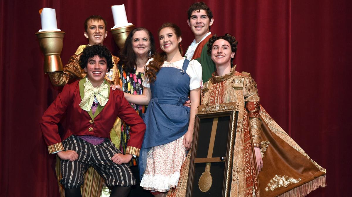 YES Company director Melanie Wyatt (third from left) is pictured Tuesday July 10, 2018 with cast members of the production Beauty & The Beast at Gallo Center For The Arts in Modesto, Calif. Beauty & The Beast is the YES Company’s 27th summer production.