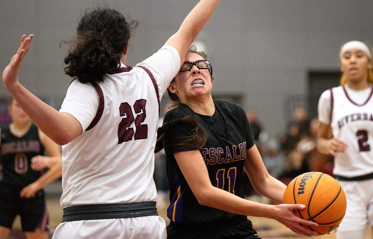 Escalon’s Arianna Velasco attacks the basket as Riverbank’s Avah Luu defends during the Trans Valley League game at Riverbank High School in Riverbank, Calif.,Thursday, Jan. 4, 2024.