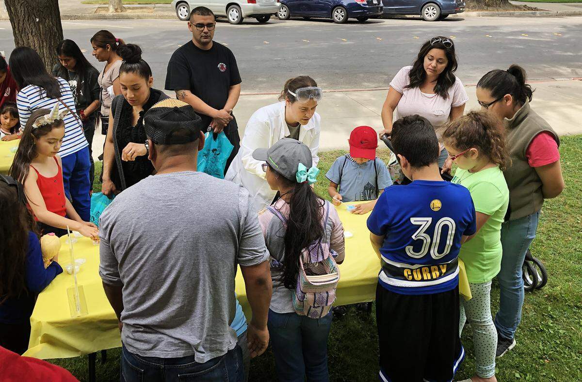 Amber O’brien-Verhulst is leading Science Magic at The Stanislaus County Library in Modesto on June 28.