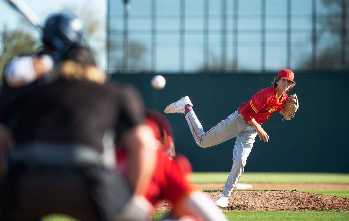 Oakdale’s Jordan Haver throws a pitch during the Valley Oak League showcase game with Central Catholic at John Thurman Field in Modesto, Calif., Friday, March 31, 2023. Oakdale won the game 10-6.