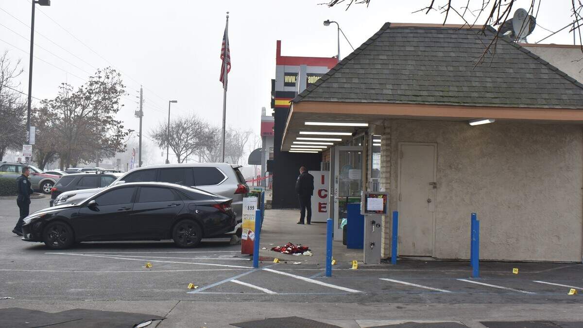 Police investigate an incident in which two people were shot at the Valero gas station on Prescott Road in Modesto, Calif., on the morning of Dec. 24, 2023.