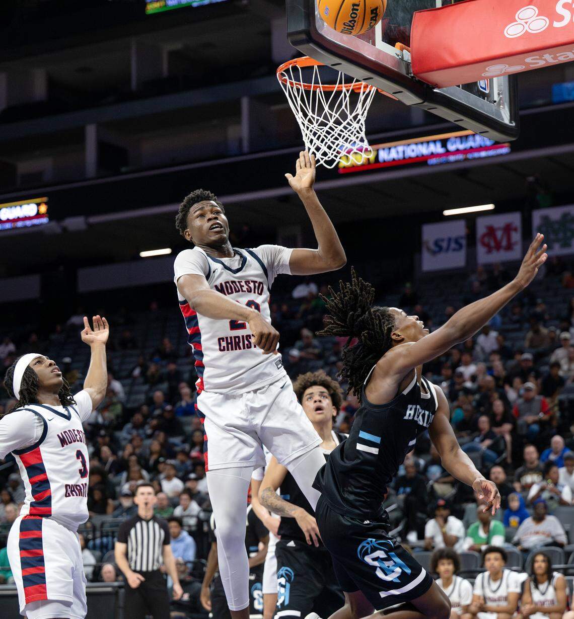 Modesto Christian’s Somto Patrick blocks the shot of Sheldon’s Baron Sabir in the Sac-Joaquin Section Division I championship game at the Golden 1 Center in Sacramento, Saturday, Feb. 28, 2026.