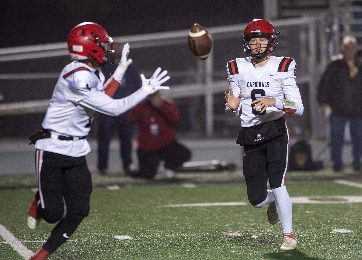 Woodland Christian quarterback Caden Pascoe pitches the ball to Billy Hinkle during the Sac-Joaquin Section Division VII championship game with Ripon Christian at St. Mary’s High School in Stockton on Friday.