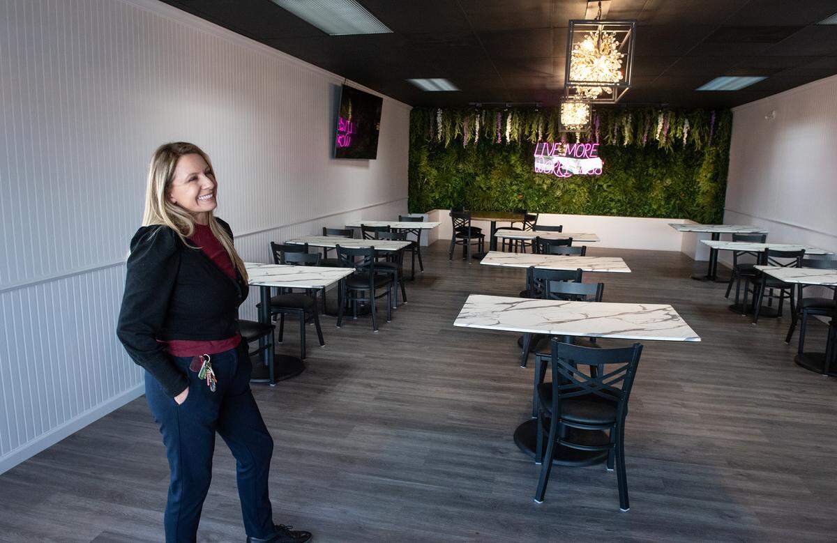 Owner Norma Moreno shows off the banquet room at The Secret Garden restaurant in Modesto, Calif., on Thursday, May 19, 2022.