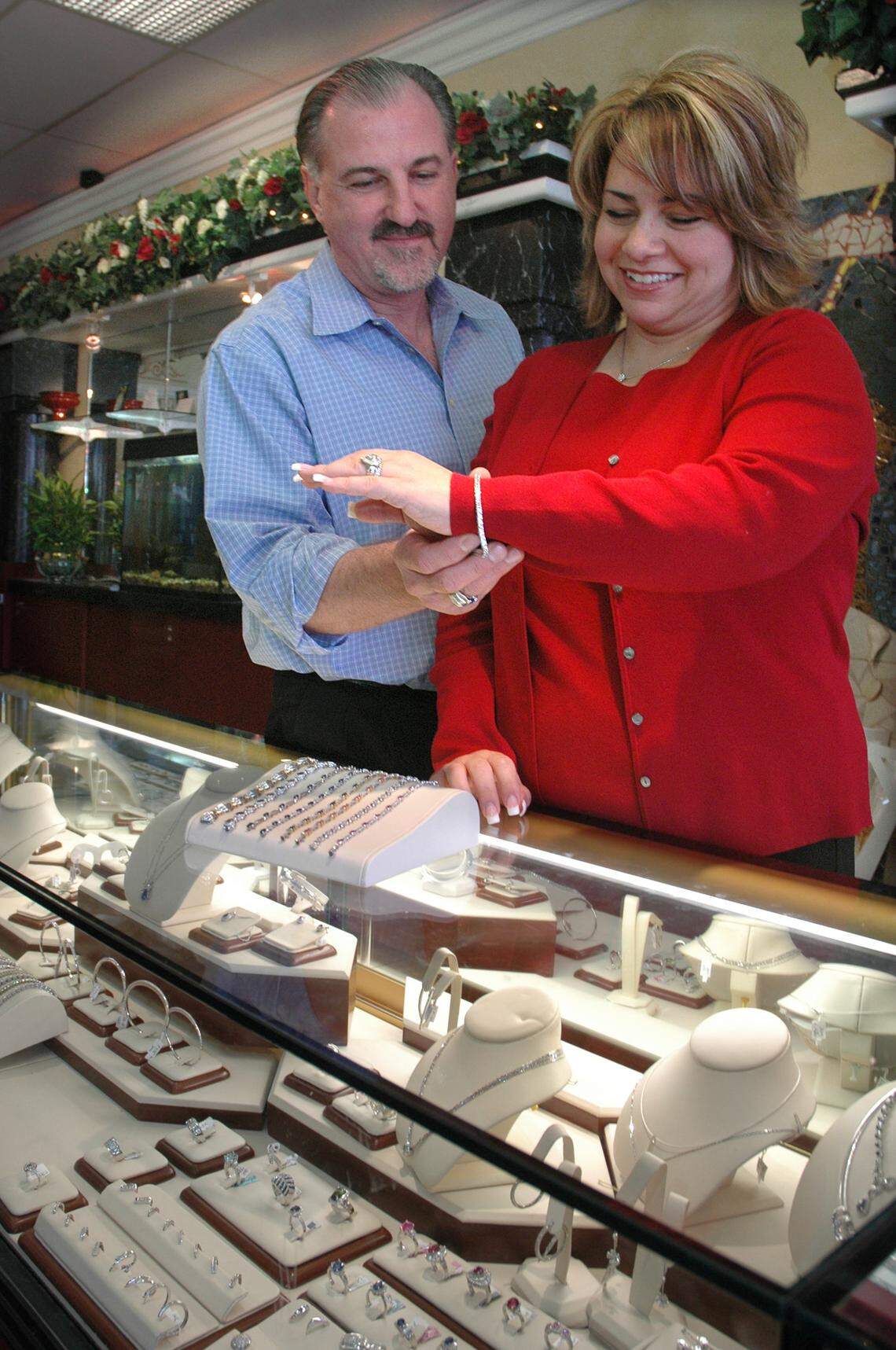 Ed Yonan and his wife, Tina Yonan as they admire one of the bracelets available for sale at Yonan's Jewelry in 2006.