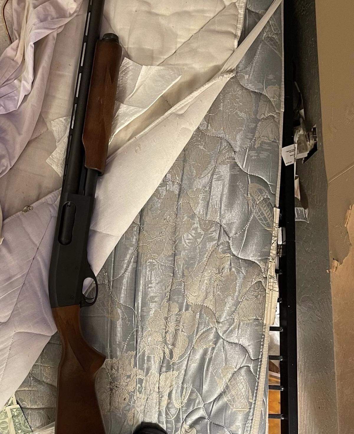 A shotgun seized during the execution of a search warrant at the Sonora Gold Lodge, where police reported finding firearms, drugs and drug-sales packaging.