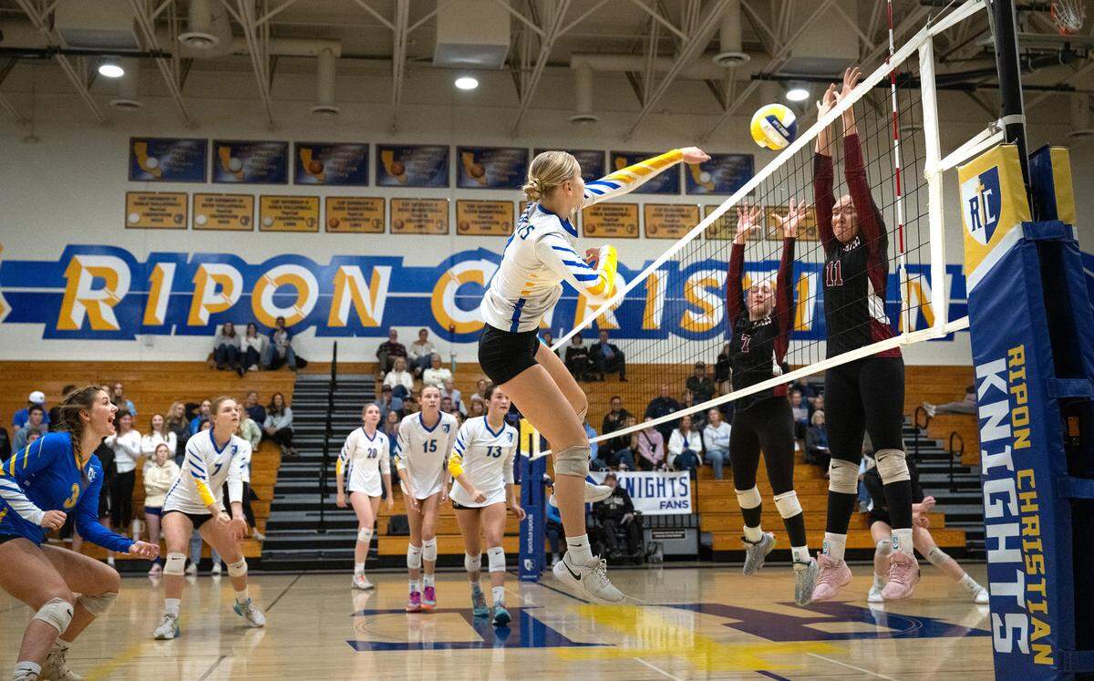 Ripon Christian’s Alyssa Hofman spikes the ball past West Valley defenders during the CIF State Division 4 playoff game at Ripon Christian High School in Ripon, Tuesday, Nov. 12, 2024. Ripon Christian won the match 3-0.
