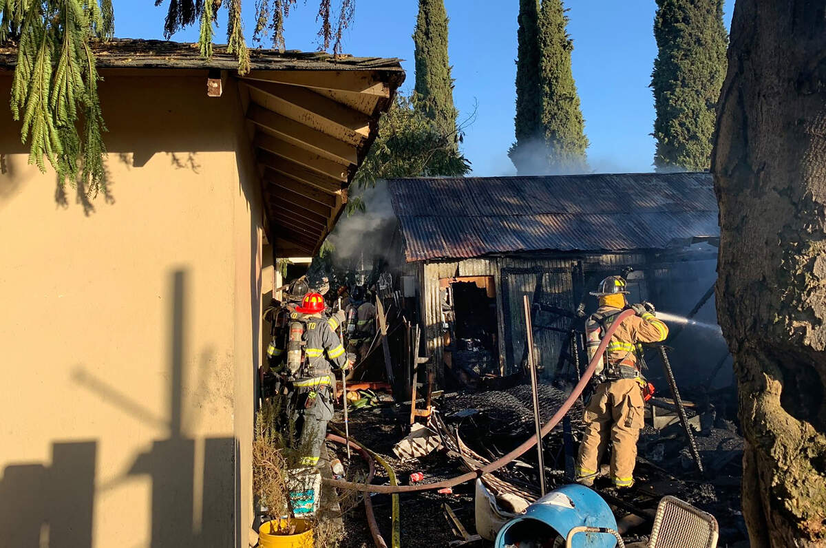 A fire destroyed a mobile home, garage and vehicle on the 100 block of I Street in Waterford, California, on Wednesday, June 19, 2019.