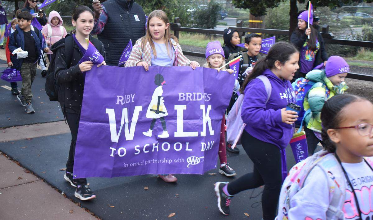 Students at Woodrow Elementary celebrated Ruby Bridges Walk to School Day on Friday, Nov. 14, 2025, by walking a short distance on the Virginia Corridor Trail from Rumble Road to their school. The national event is held annually on Nov. 14 to honor civil rights icon Ruby Bridges and her historic walk to an all-white school in 1960.