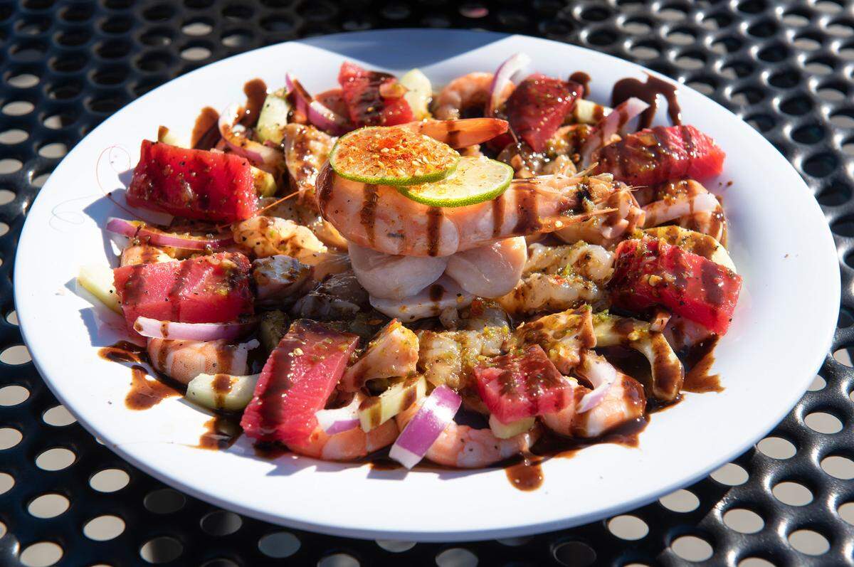 Botana Mixta seafood plate from Mariscos Algo Bien food truck at La Placita food truck park on 9th Street in Modesto, Calif., Tuesday, Dec. 13, 2022.