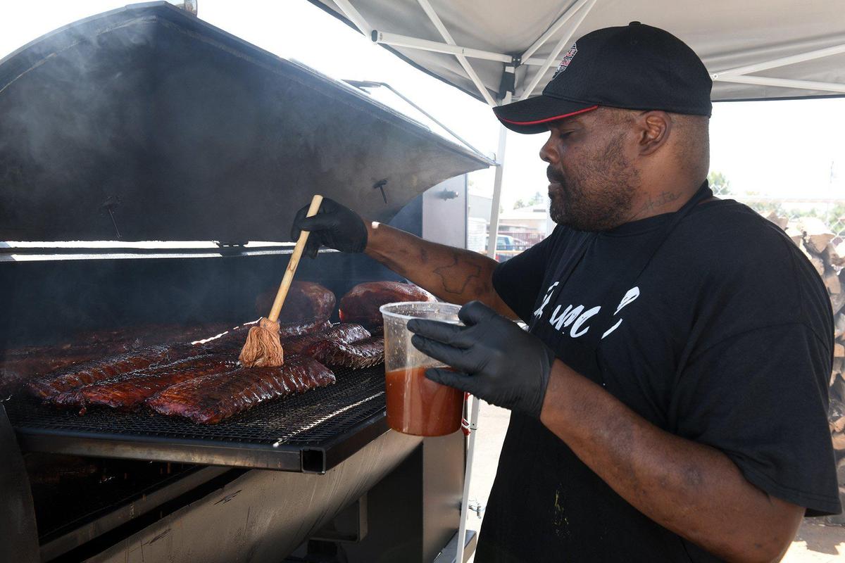Chef Marc Byrd works the grill on Thursday August 22, 2019 at Fire and Desire BBQ located in Grub Hubs in downtown Modesto, Calif.