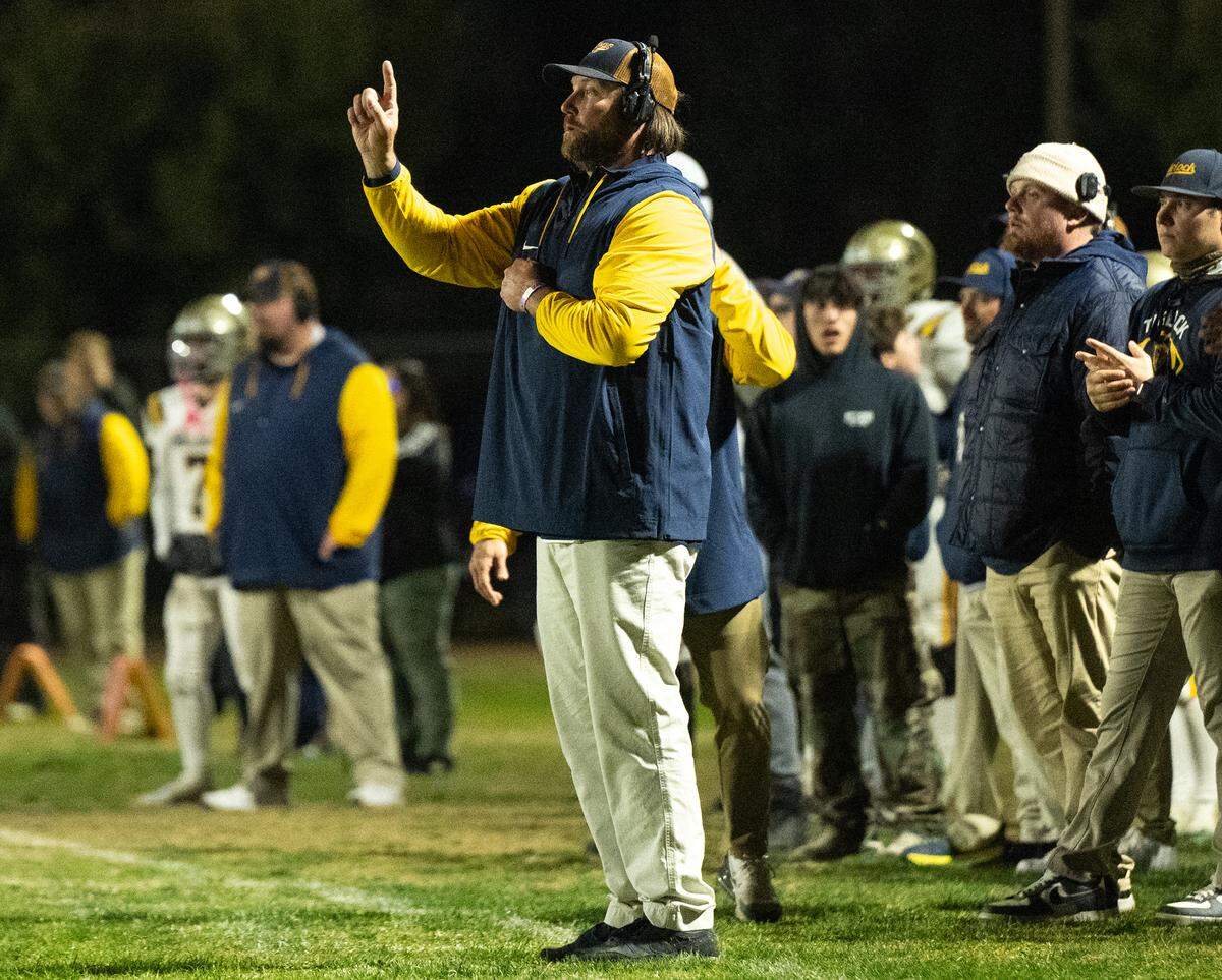 Turlock head coach James Peterson directs his defensive unit during the Sac-Joaquin Section Division I playoff game with Central Catholic at Central Catholic High School in Modesto, Friday, Nov. 15, 2024.