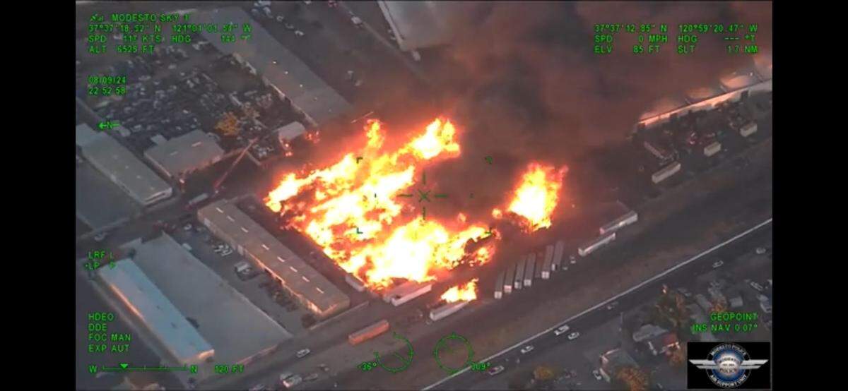 A screenshot of aerial footage from the Modesto Police Department of a fire on the 600 block of Janopaul lane in Modesto on Friday, Aug. 09, 2024.
