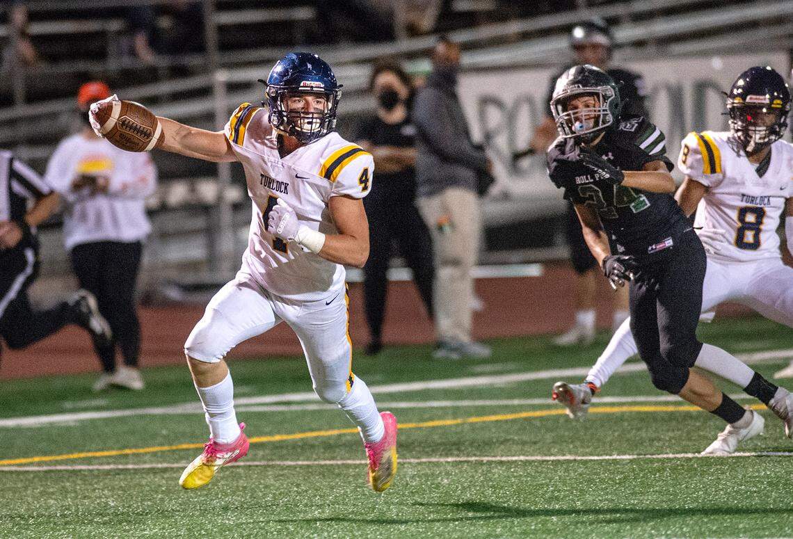 Turlock’s Cade Gilbert runs into the end zone for a touchdown during the Central California Athletic League game with Pitman at Turlock High School in Turlock, Calif., on Friday, April 16, 2021.