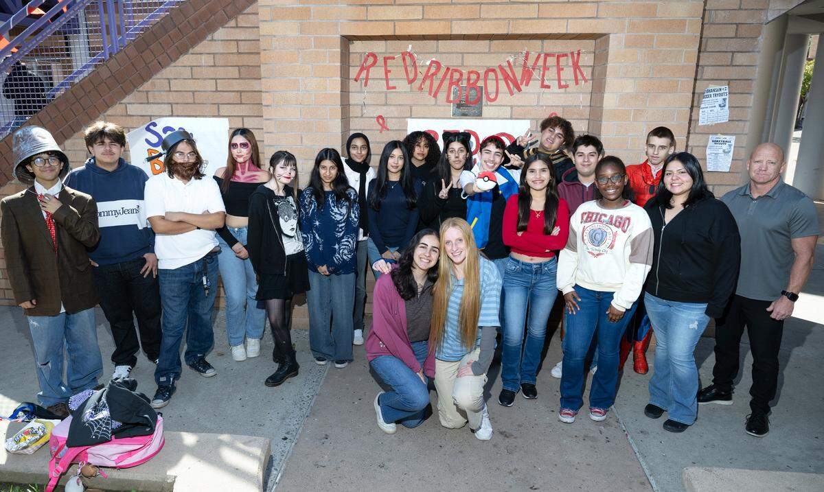 Johansen Advanced Placement government students, some who are dressed in halloween costumes, are working as Stanislaus County poll workers during this election. Photographed at Johansen High School in Modesto, Thursday, Oct. 31, 2024.