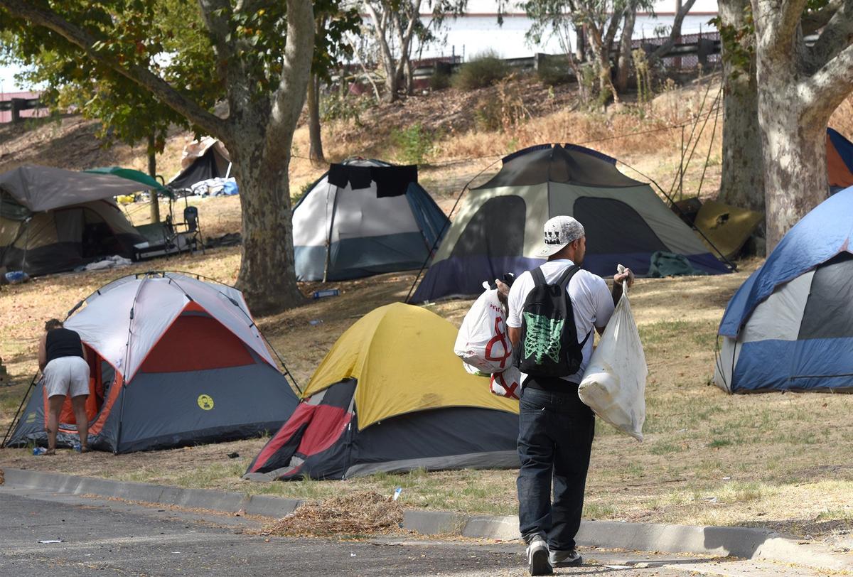 A homeless camp is pictured Friday morning Sept. 28, 2018 in Beard Brook Park in Modesto, Calif. The City of Modesto is allowing homeless people to camp there as a temporary solution.