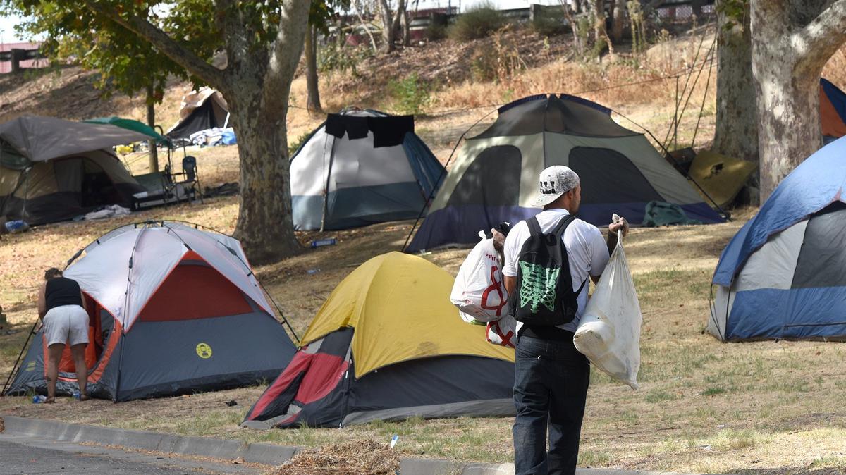 A homeless camp is pictured Friday morning Sept. 28, 2018 in Beard Brook Park in Modesto, Calif. The City of Modesto is allowing homeless people to camp there as a temporary solution.