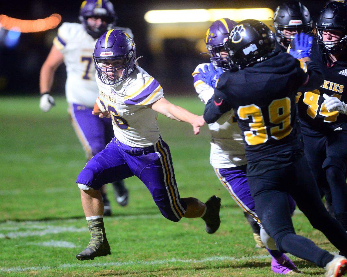 Orestimba running back Drake Perez runs behind a blocker during a Sac-Joaquin Section Division VI playoff game against Hughson in Hughson, California, on Nov. 18, 2022. Hughson won 21-17.
