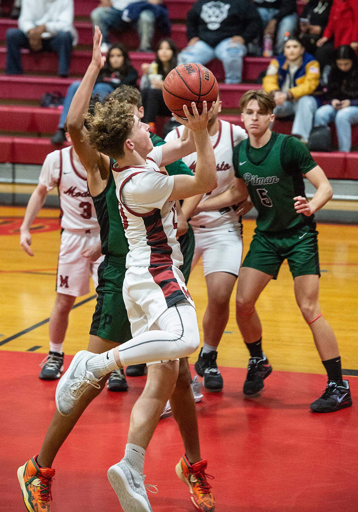Modesto’s Andrew Poulsen scores during a Central California Athletic League game with Pitman at Modesto High School in Modesto, Calif., Friday, Jan. 13, 2023.