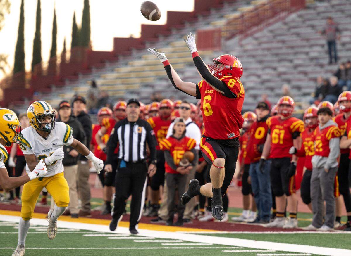 Oakdale’s Chase Lopez makes a catch along the sideline to set up a touchdown during the Sac-Joaquin Section Division 3 championship game with Vanden at Sacramento City College in Sacramento on Saturday, Nov. 30, 2024.